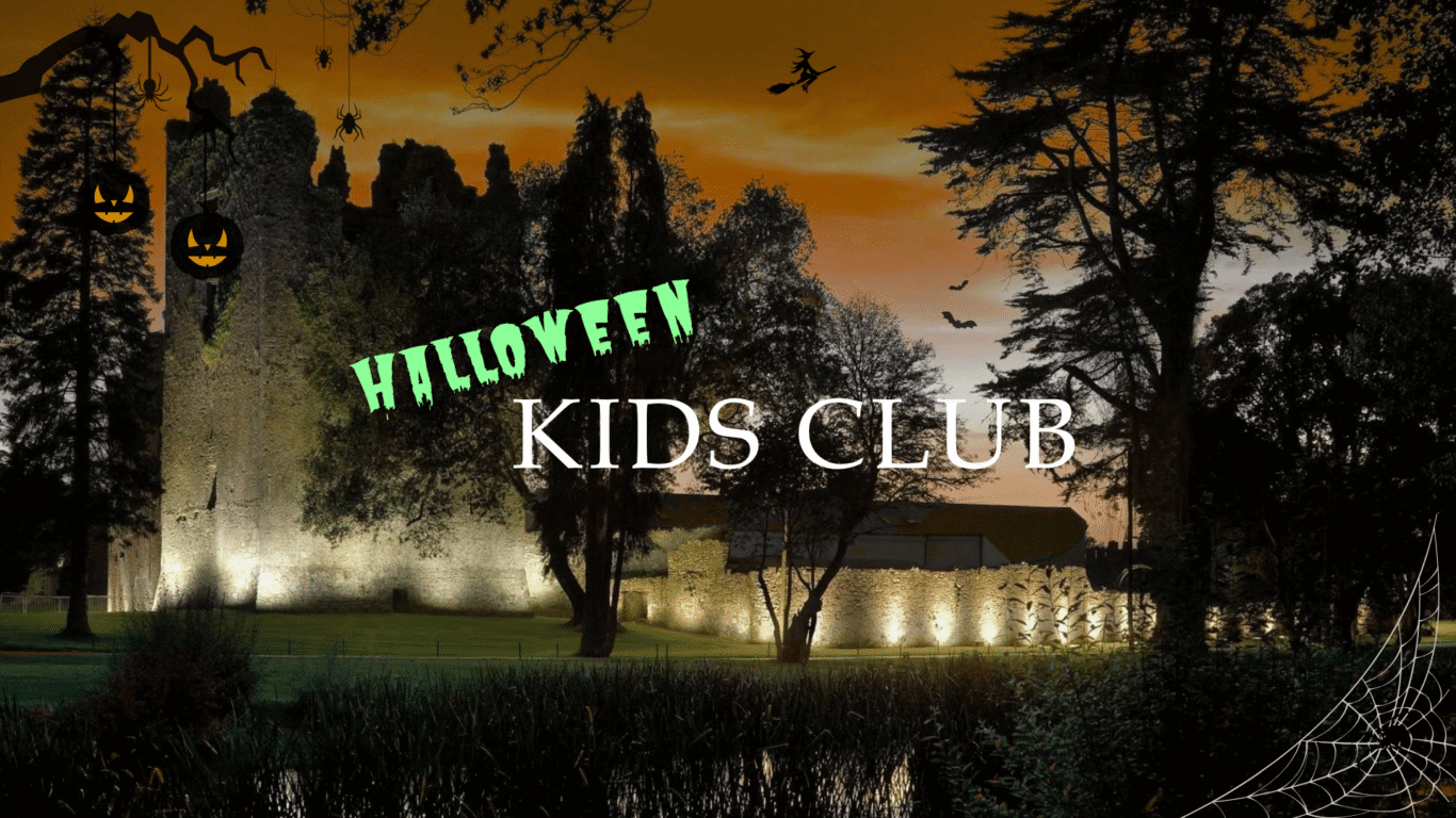 Illuminated castle at dusk with Halloween decor, trees silhouetted; perfect for family stays and Halloween kids club.